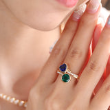 14K Yellow Gold Heart Lab Sapphire and Round Zambian Lab Emerald Toi et Moi Ring with Twist Band 14K Yellow Gold Heart Lab Sapphire and Round Zambian Lab Emerald Toi et Moi Ring with Twist Band