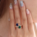14K Yellow Gold Heart Lab Sapphire and Round Zambian Lab Emerald Toi et Moi Ring with Twist Band 14K Yellow Gold Heart Lab Sapphire and Round Zambian Lab Emerald Toi et Moi Ring with Twist Band