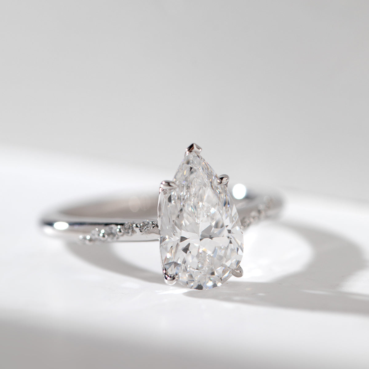 14K White Gold 2ct Pear Cut Lab Diamond Ring with Twist Pave Band and Floral Basket Head Design 14K White Gold 2ct Pear Cut Lab Diamond Ring with Twist Pave Band and Floral Basket Head Design