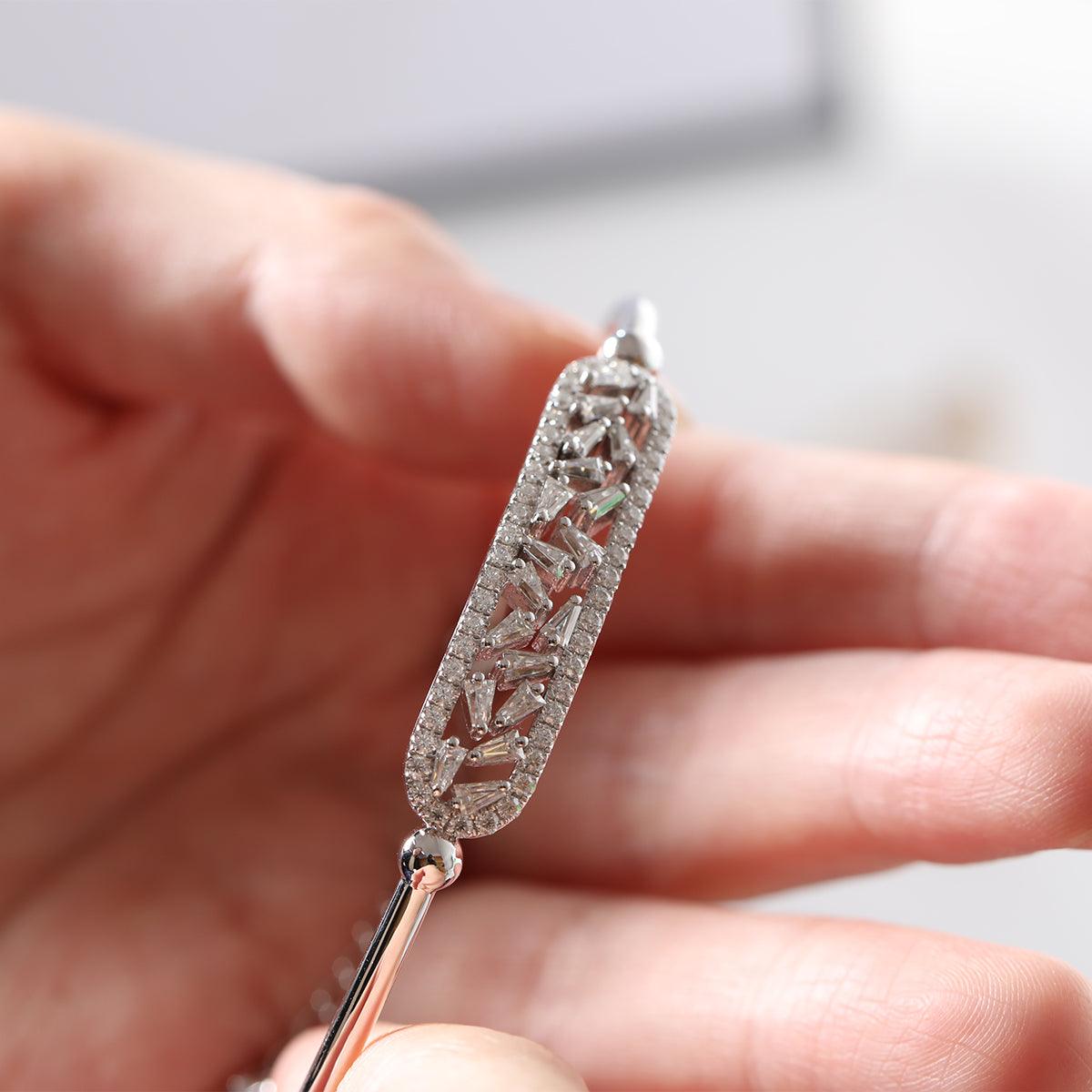 14K White Gold Cuff Bangle Bracelet with Tapered Baguette Cut and Round Cut Diamonds 14K White Gold Cuff Bangle Bracelet with Tapered Baguette Cut and Round Cut Diamonds