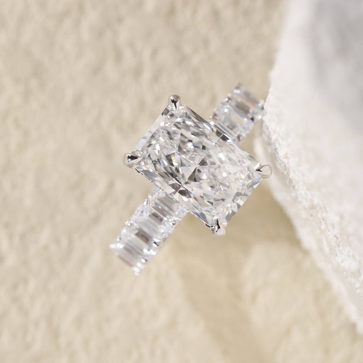 Platinum 4ct Radiant Cut Lab Diamond 4 Calw Prong Basket Ring with Round Lab Diamond Hiddden-Halo and Emerald Cut Lab Diamond Pave Platinum 4ct Radiant Cut Lab Diamond 4 Calw Prong Basket Ring with Round Lab Diamond Hiddden-Halo and Emerald Cut Lab Diamond Pave