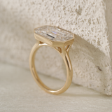 14K Yellow Gold 2.5ct Antique Emerald Cut Lab Diamond Ring with Tapered Step Cut Lab Diamond Halo 14K Yellow Gold 2.5ct Antique Emerald Cut Lab Diamond Ring with Tapered Step Cut Lab Diamond Halo