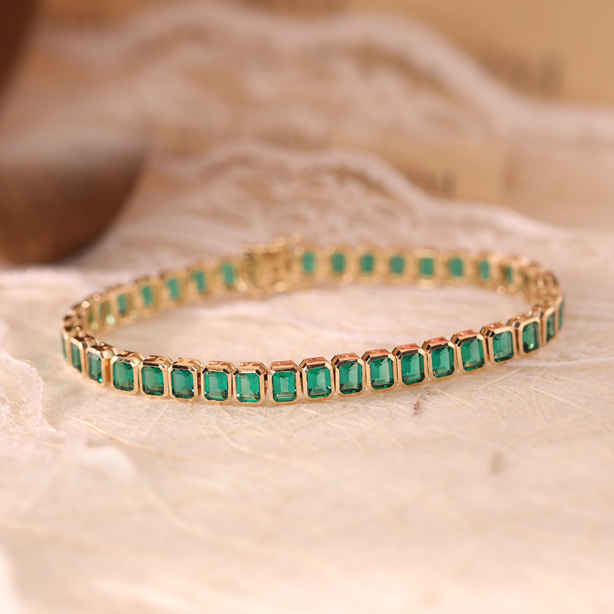 14K Yellow Gold Emerald Cut Lab Zambian Emerald Bezel Tennis Bracelet 14K Yellow Gold Emerald Cut Lab Zambian Emerald Bezel Tennis Bracelet